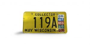 1980 HEAVILY STICKERED WISCONSIN LICENSE PLATE COLLECTOR 119A