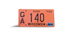 1992 WISCONSIN FARM LICENSE PLATE 140 WITH STICKER