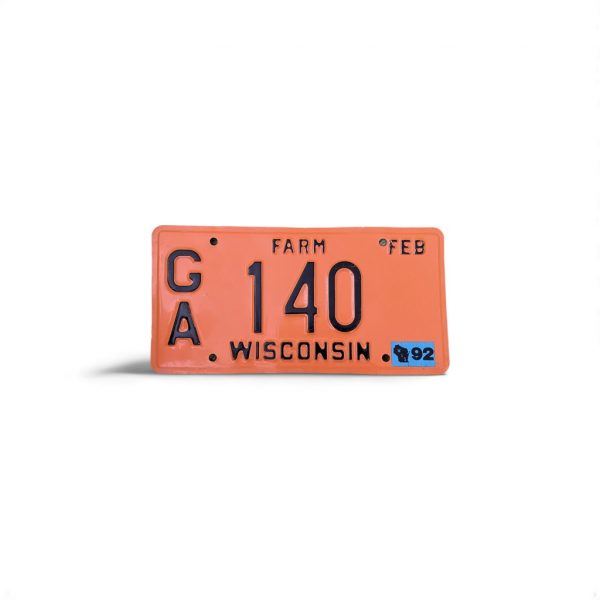 1992 WISCONSIN FARM LICENSE PLATE 140 WITH STICKER